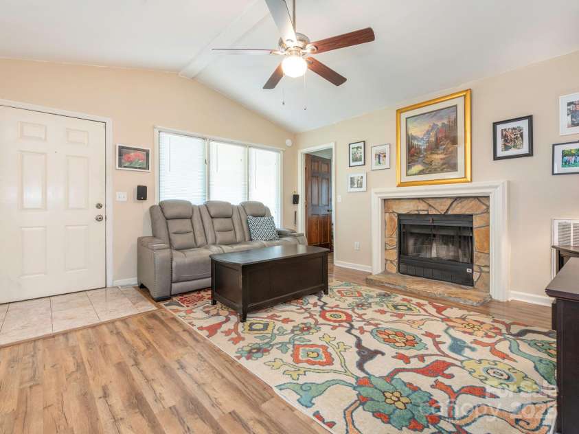 1022 Kenilworth Court, Concord, NC 28027.  MLS# CAR4243363, YatesRealty ID 6397. Living room with vaulted ceiling & fireplace