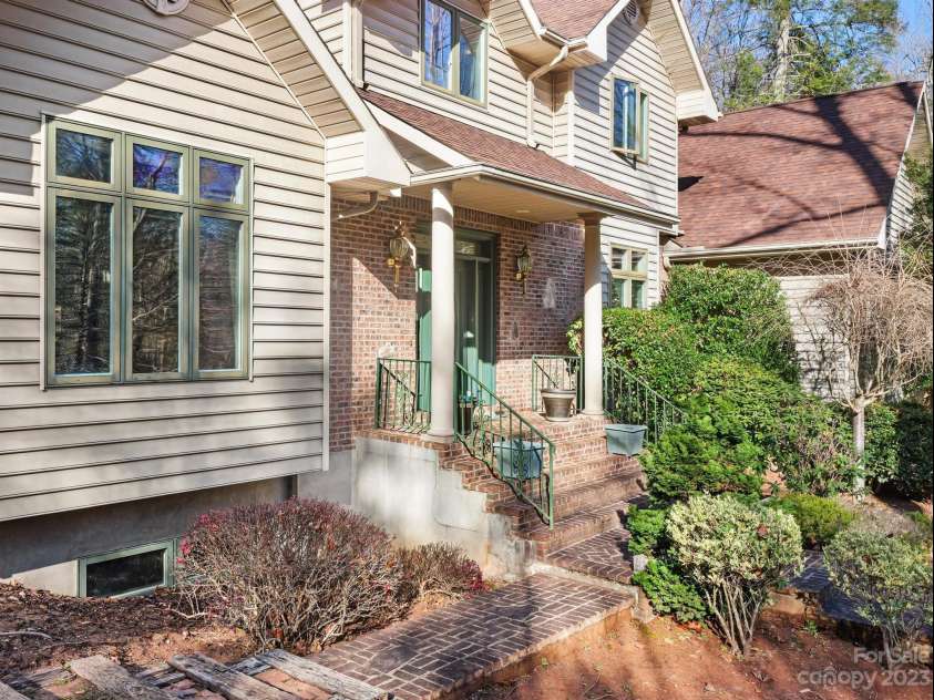 136 Rumbling Bald Road, Lake Lure, NC 28746.  MLS# CAR4093913, YatesRealty ID 64. Close up front entry