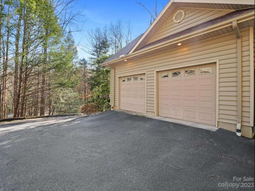 136 Rumbling Bald Road, Lake Lure, NC 28746.  MLS# CAR4093913, YatesRealty ID 64. Garage and extra parking