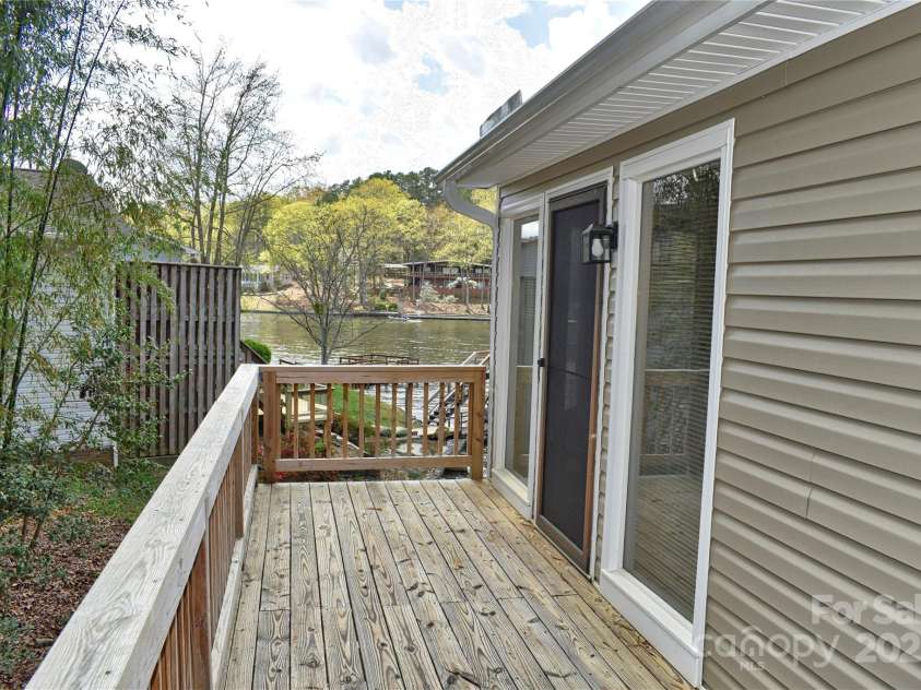458 Pinehaven Drive, Badin Lake, NC 28127.  MLS# CAR4242649, YatesRealty ID 6402. 2nd deck on the south side of the house.