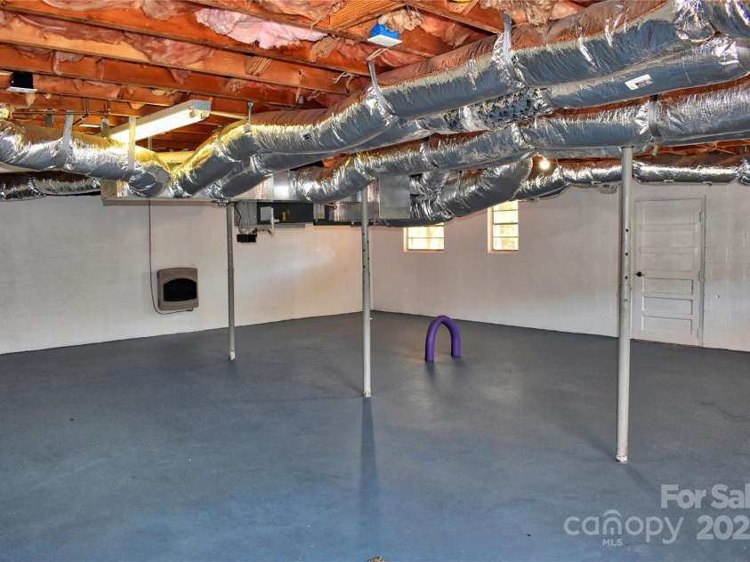 458 Pinehaven Drive, Badin Lake, NC 28127.  MLS# CAR4242649, YatesRealty ID 6402. Spacious basement area has lots of potential.