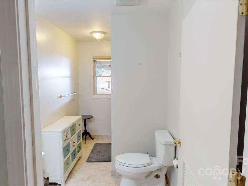 78 Smiling Fox Trail, Brevard, NC 28712.  MLS# CAR4176816, YatesRealty ID 641. Main house bathroom