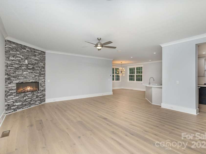 2305 Sanders Avenue, Charlotte, NC 28216.  MLS# CAR4187672, YatesRealty ID 6413. Family room with the fireplace