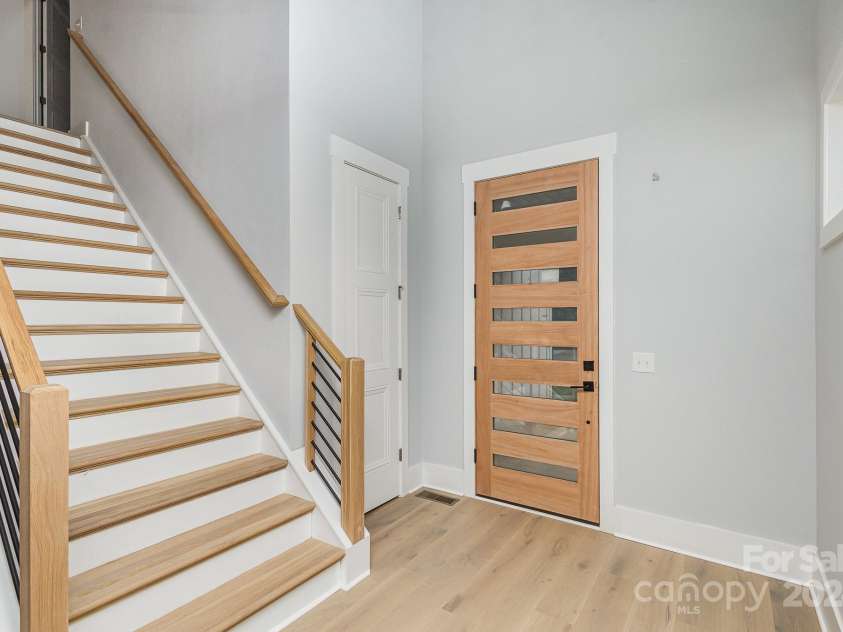 2305 Sanders Avenue, Charlotte, NC 28216.  MLS# CAR4187672, YatesRealty ID 6413. Wide stairs to the upper floor