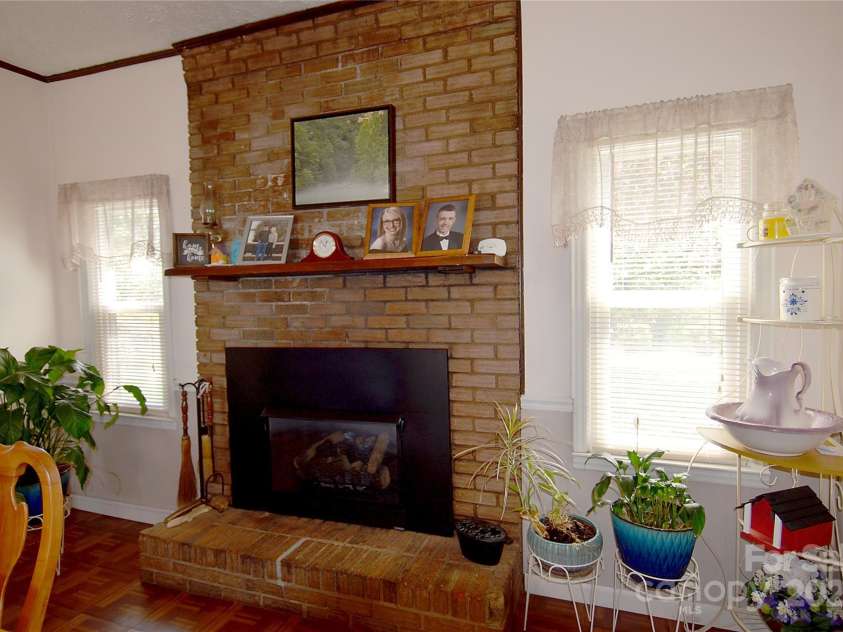 5360 Franklin Place, Collettsville, NC 28611.  MLS# CAR4240351, YatesRealty ID 6416. Fireplace in kitchen/dining