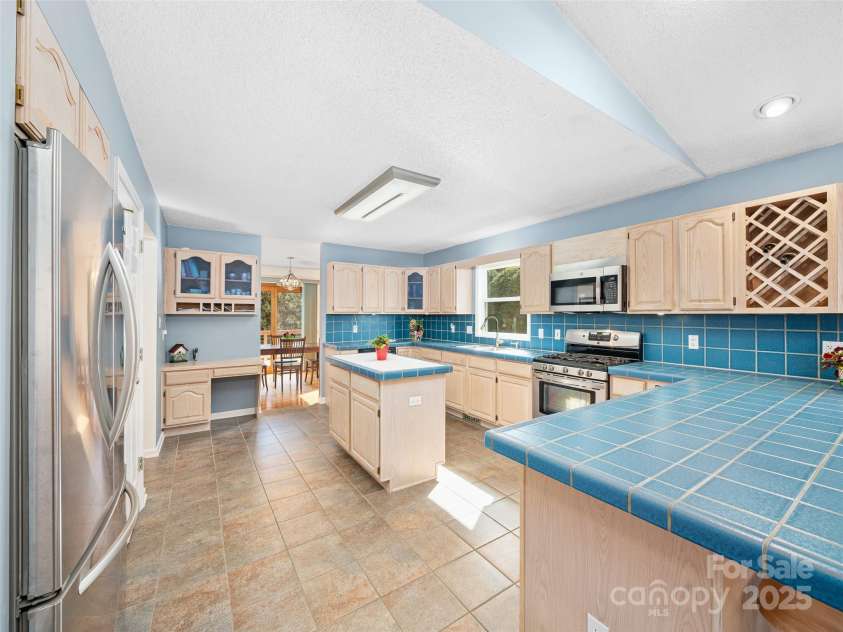 105 Goldfinch Lane, Asheville, NC 28803.  MLS# CAR4318558, YatesRealty ID 6417. Huge kitchen with ample cabinets and workspace.