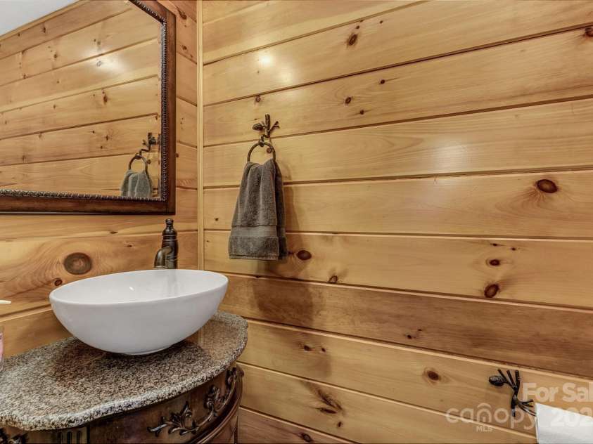 120 Sweetbriar Road, Lake Lure, NC 28746.  MLS# CAR4291551, YatesRealty ID 642. Back inside, half bath downstairs for visitors