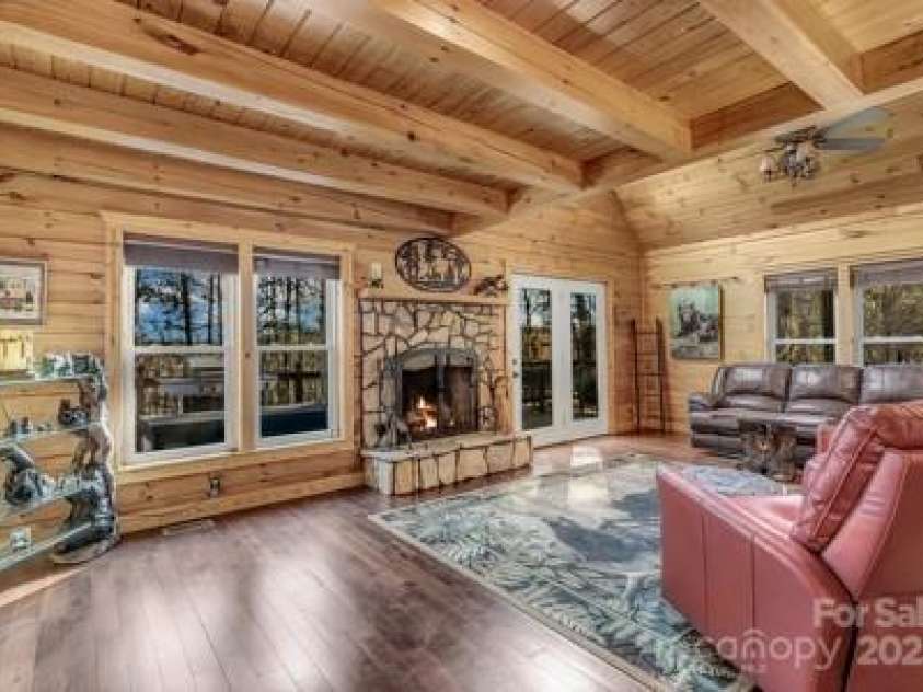 120 Sweetbriar Road, Lake Lure, NC 28746.  MLS# CAR4291551, YatesRealty ID 642. Easily transition from relaxing in the living room to the deck through the double doors.