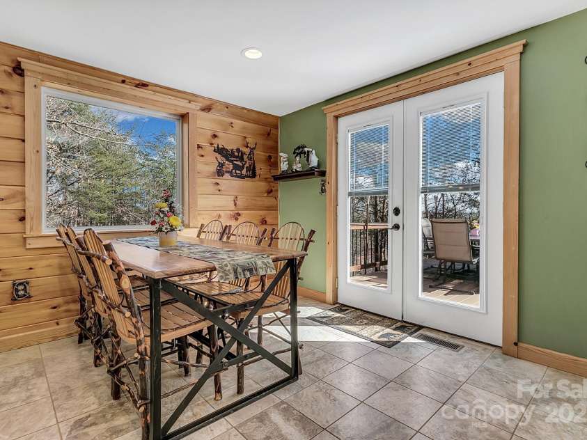 120 Sweetbriar Road, Lake Lure, NC 28746.  MLS# CAR4291551, YatesRealty ID 642. Exit to the large deck to gather for an outdoor dinner if you'd like.