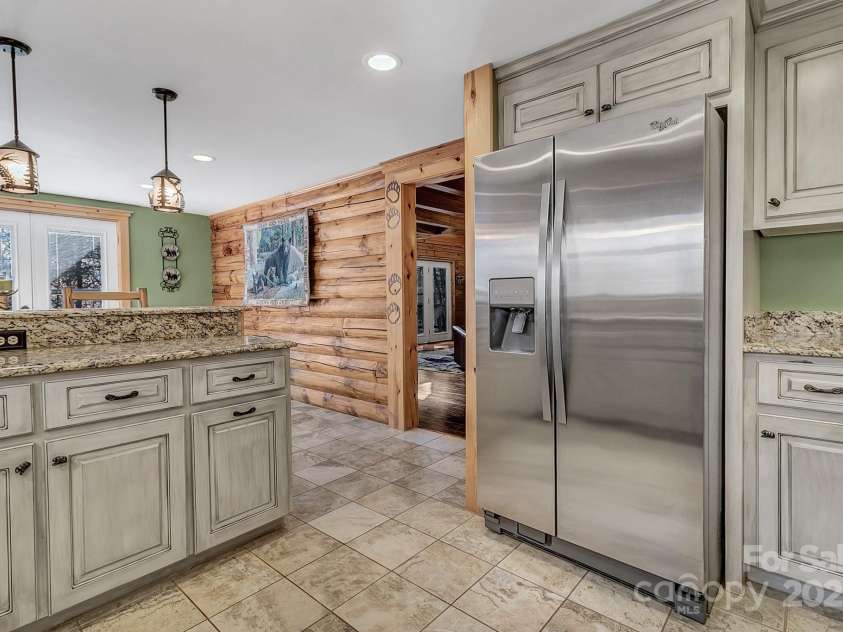 120 Sweetbriar Road, Lake Lure, NC 28746.  MLS# CAR4291551, YatesRealty ID 642. Kitchen into living room and dining area.