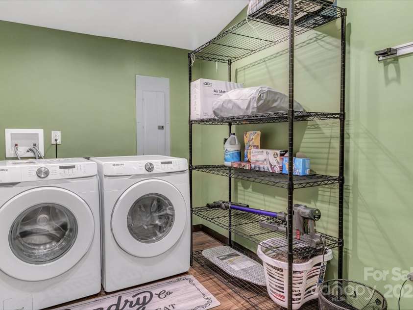 120 Sweetbriar Road, Lake Lure, NC 28746.  MLS# CAR4291551, YatesRealty ID 642. Laundry Room - Upper Level featuring high efficiency Samsung Washer and Dryer, plus a Dyson for your cleaning needs.