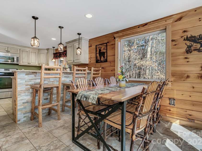 120 Sweetbriar Road, Lake Lure, NC 28746.  MLS# CAR4291551, YatesRealty ID 642. Open kitchen and dining, perfect for hosting or a quiet dinner at home