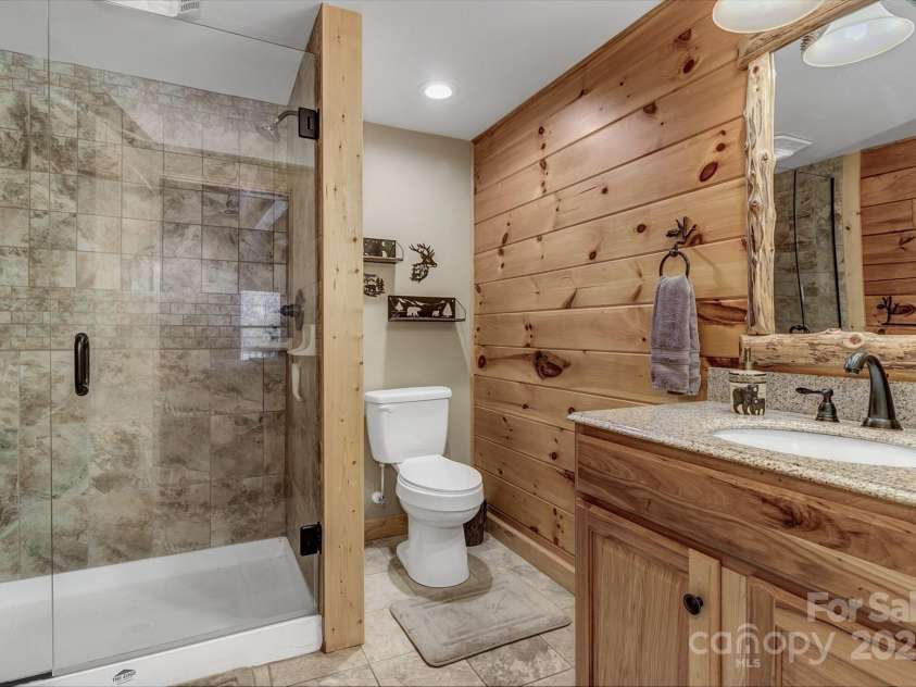 120 Sweetbriar Road, Lake Lure, NC 28746.  MLS# CAR4291551, YatesRealty ID 642. Primary Ensuite with walk in shower.