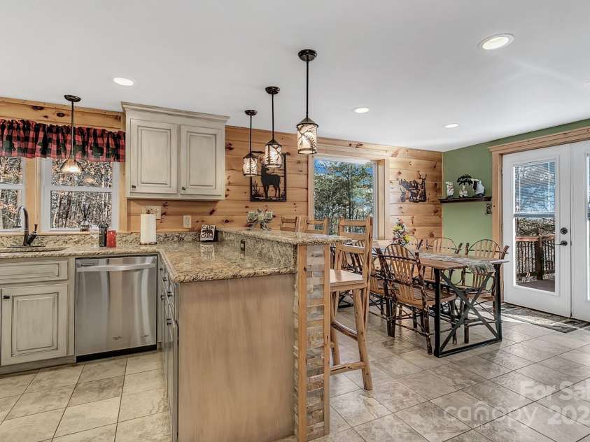120 Sweetbriar Road, Lake Lure, NC 28746.  MLS# CAR4291551, YatesRealty ID 642. Upon entry to the kitchen and dining area