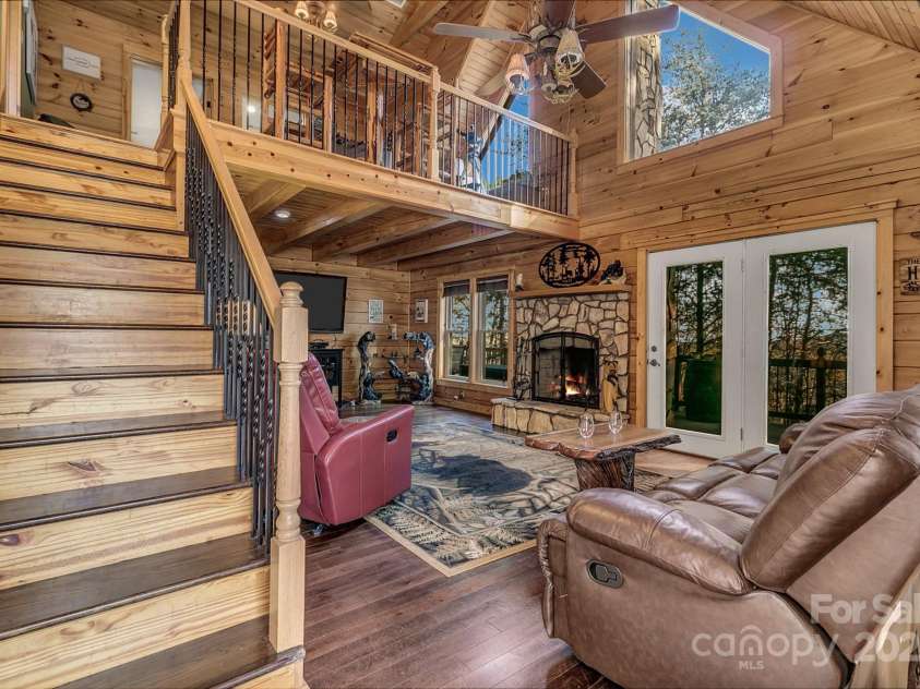 120 Sweetbriar Road, Lake Lure, NC 28746.  MLS# CAR4291551, YatesRealty ID 642. Walk in to a bright open living room upon entry, primary bedroom on the left.