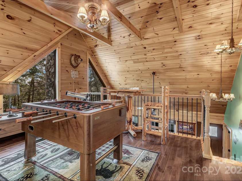 120 Sweetbriar Road, Lake Lure, NC 28746.  MLS# CAR4291551, YatesRealty ID 642. Walk upstairs to the game room loft adjoining two additional bed rooms!