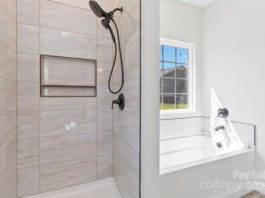 213 Sheffield Drive, York, SC 29745.  MLS# CAR4099016, YatesRealty ID 642. Primary ensuite shower and soaker tub