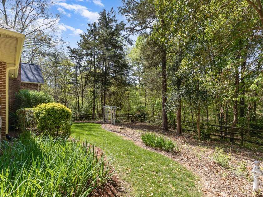 481 Patriot Court, Concord, NC 28025.  MLS# CAR4243894, YatesRealty ID 6424. Beautiful back yard with deck off of kitchen