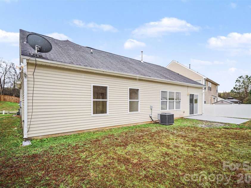 7941 Mossycup Drive, Charlotte, NC 28215.  MLS# CAR4292875, YatesRealty ID 6426. Back Exterior