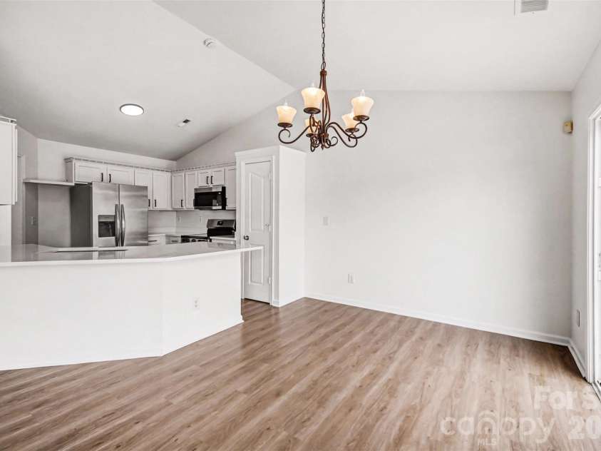 7941 Mossycup Drive, Charlotte, NC 28215.  MLS# CAR4292875, YatesRealty ID 6426. Dining area & kitchen