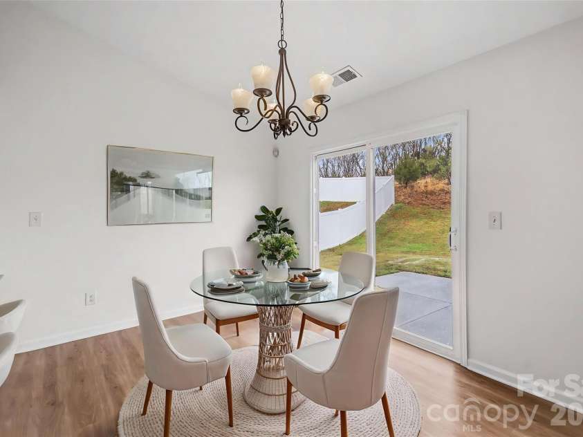 7941 Mossycup Drive, Charlotte, NC 28215.  MLS# CAR4292875, YatesRealty ID 6426. Dining Area *Virtually Staged*