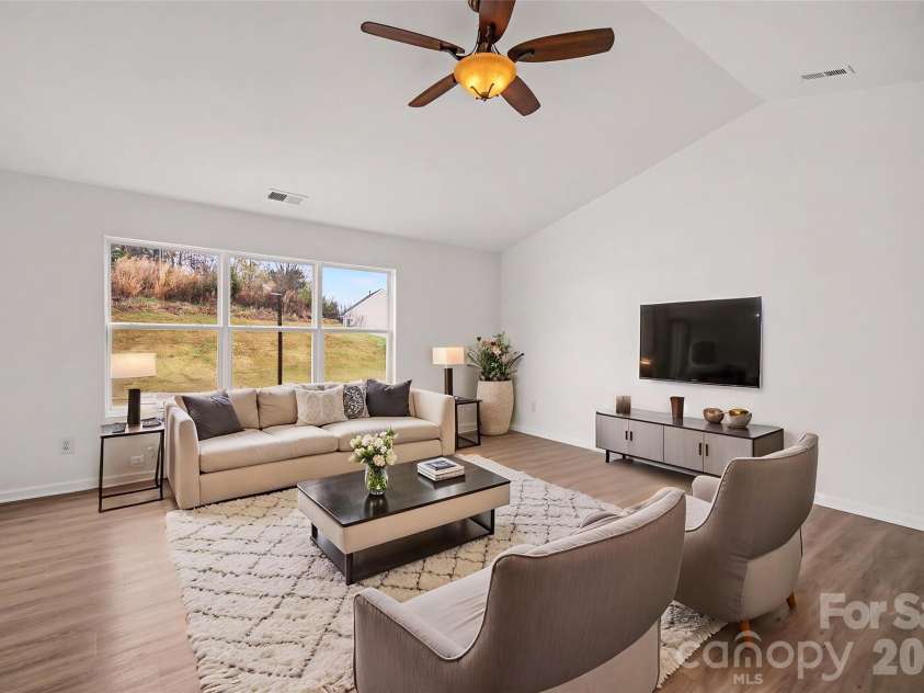 7941 Mossycup Drive, Charlotte, NC 28215.  MLS# CAR4292875, YatesRealty ID 6426. Living Room *Virtually Staged*