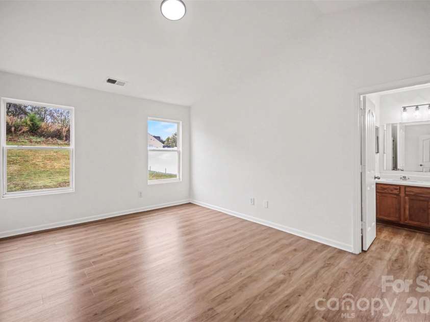 7941 Mossycup Drive, Charlotte, NC 28215.  MLS# CAR4292875, YatesRealty ID 6426. Primary Bedroom