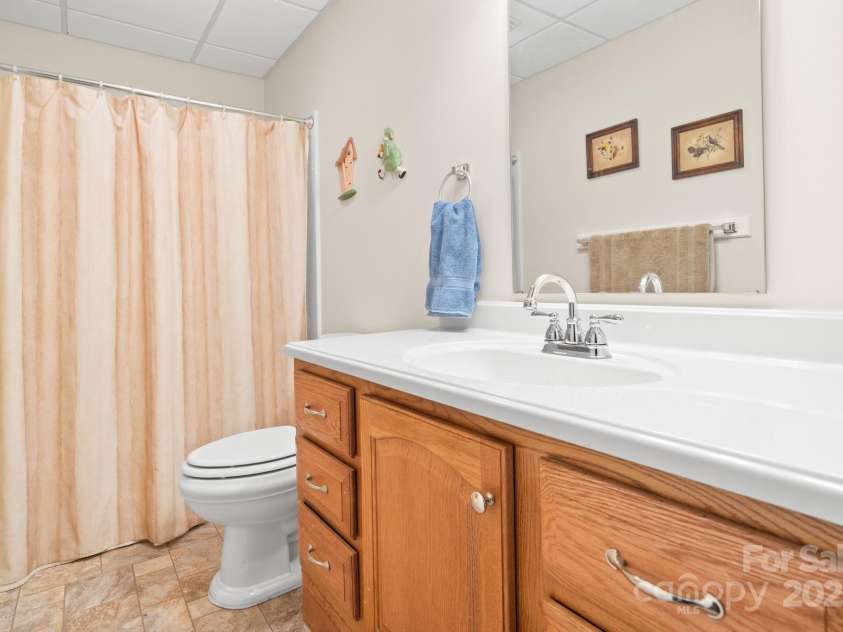 2959/2961 Bearwallow Mountain Road, Hendersonville, NC 28792.  MLS# CAR4209575, YatesRealty ID 6430. Full bathroom in the basement