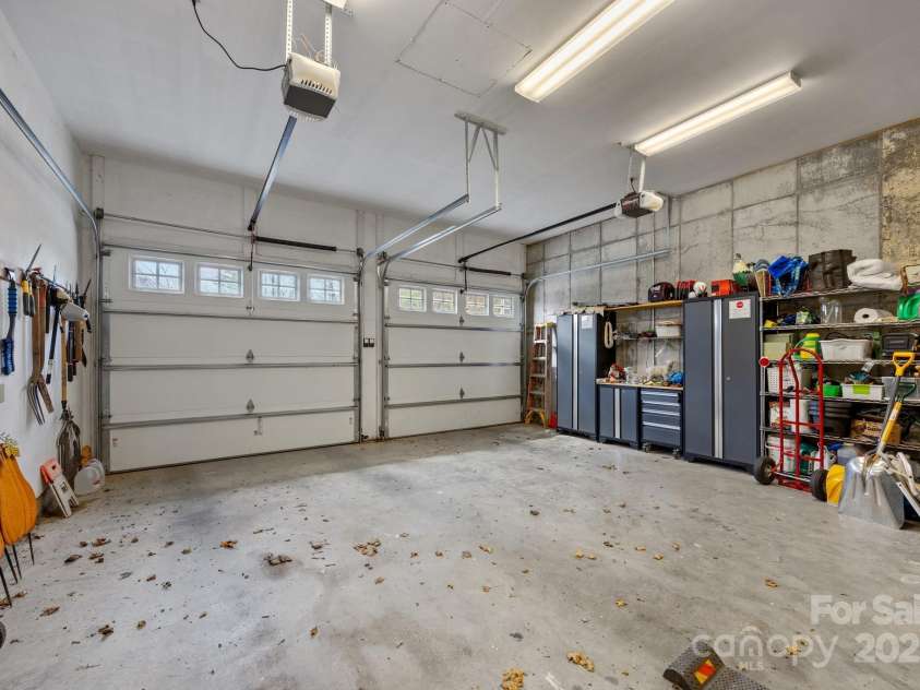 92 Branch Road, Spruce Pine, NC 28777.  MLS# CAR4246007, YatesRealty ID 6435. 2 car garage with shelving