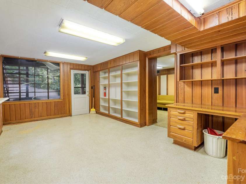 2756 Peachtree Road, Statesville, NC 28625.  MLS# CAR4072282, YatesRealty ID 644. Basement, storage, shelving also shows windows looking out to side yard/ deck area. 