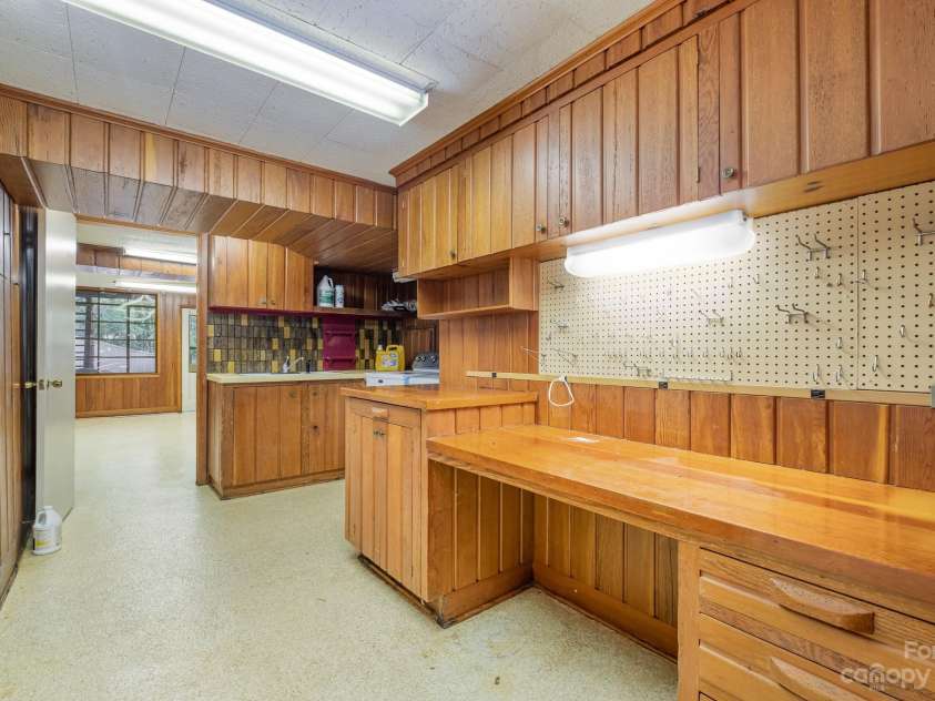 2756 Peachtree Road, Statesville, NC 28625.  MLS# CAR4072282, YatesRealty ID 644. Utility area with laundry with brand new washer/dryer that conveys and work/office area.  