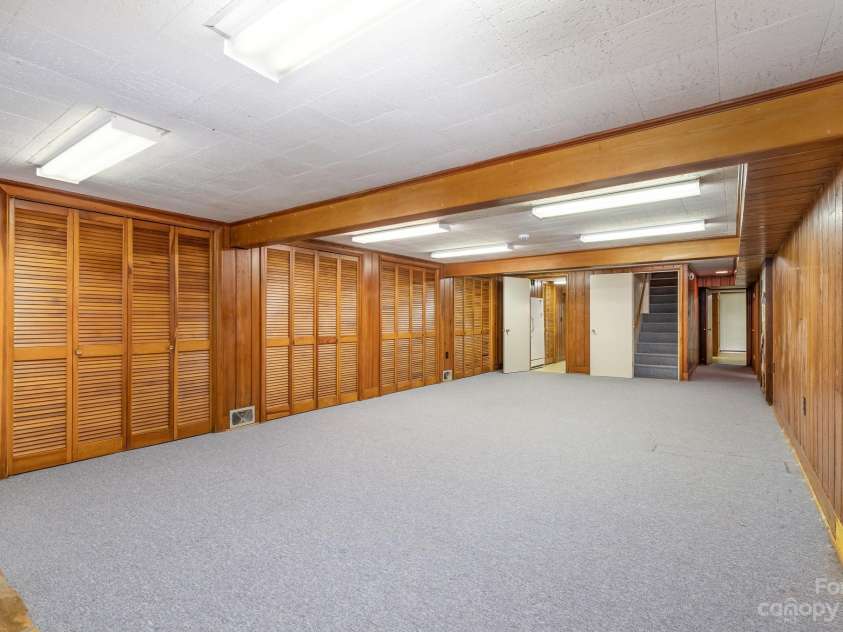 2756 Peachtree Road, Statesville, NC 28625.  MLS# CAR4072282, YatesRealty ID 644. View of basement looking back toward stairs, bedroom, bathroom, and office/craft/art area.