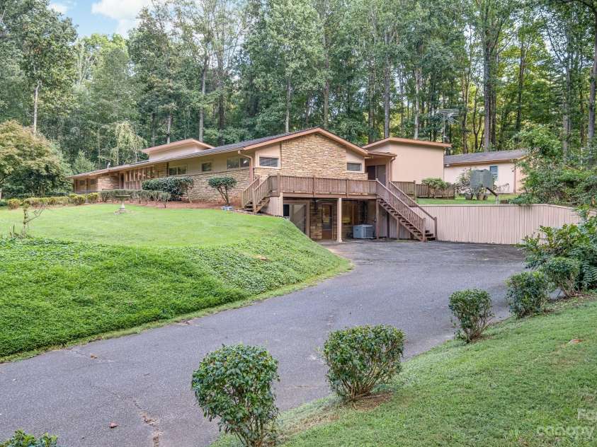 2756 Peachtree Road, Statesville, NC 28625.  MLS# CAR4072282, YatesRealty ID 644. View of side of home entrance to basement and deck. 