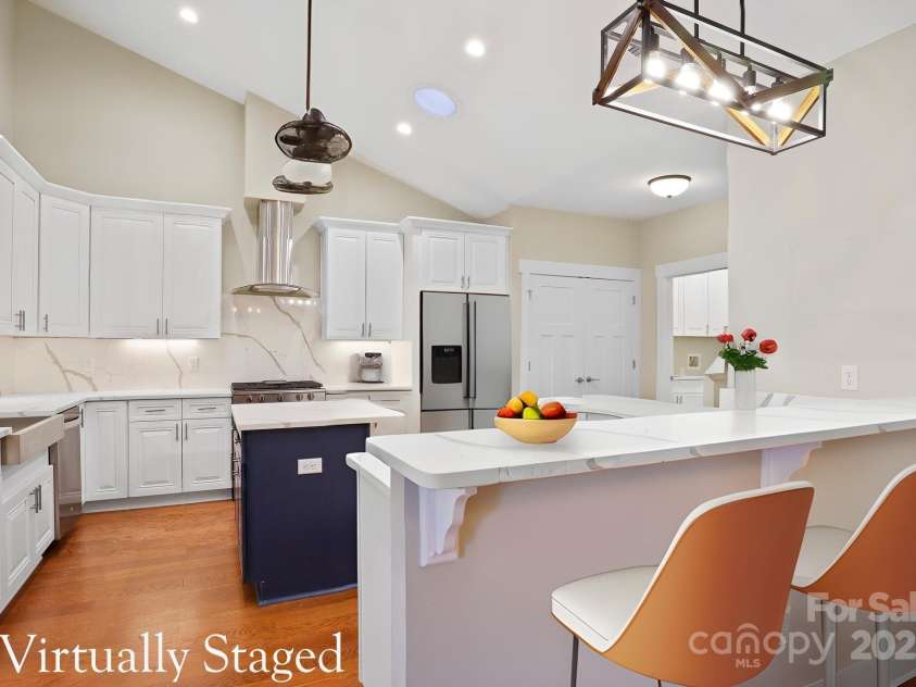 28-S-2 Brookstone Place, Candler, NC 28715.  MLS# CAR4289993, YatesRealty ID 6445. Large kitchen with island, plentiful storage, and ideal layout for hosting