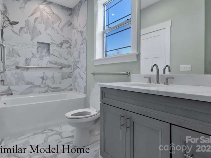 28-S-2 Brookstone Place, Candler, NC 28715.  MLS# CAR4289993, YatesRealty ID 6445. Main Level En Suite GUEST Full Bath