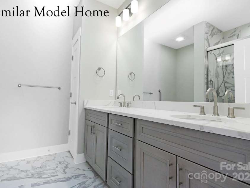 28-S-2 Brookstone Place, Candler, NC 28715.  MLS# CAR4289993, YatesRealty ID 6445. Main Level Primary Bathroom
