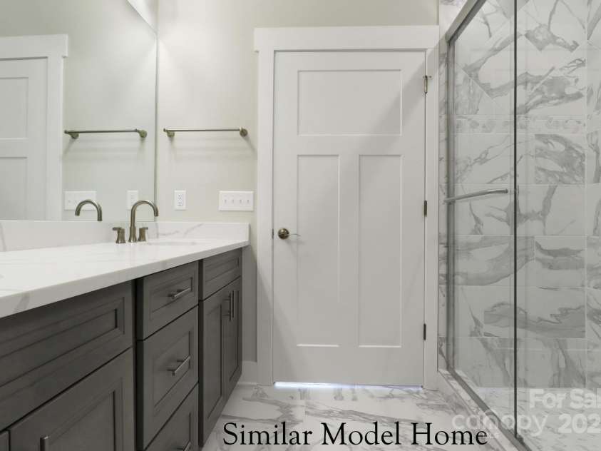 28-S-2 Brookstone Place, Candler, NC 28715.  MLS# CAR4289993, YatesRealty ID 6445. Main Level Primary Shower