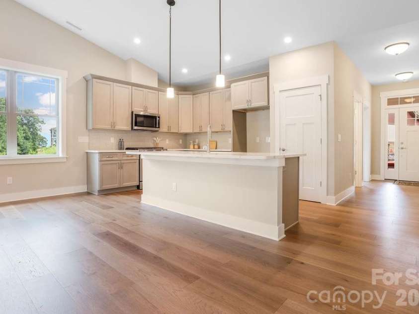 19 Craftsman Overlook Ridge, Arden, NC 28704.  MLS# CAR4342379, YatesRealty ID 6451. Bright spacious kitchen with lots of storage.