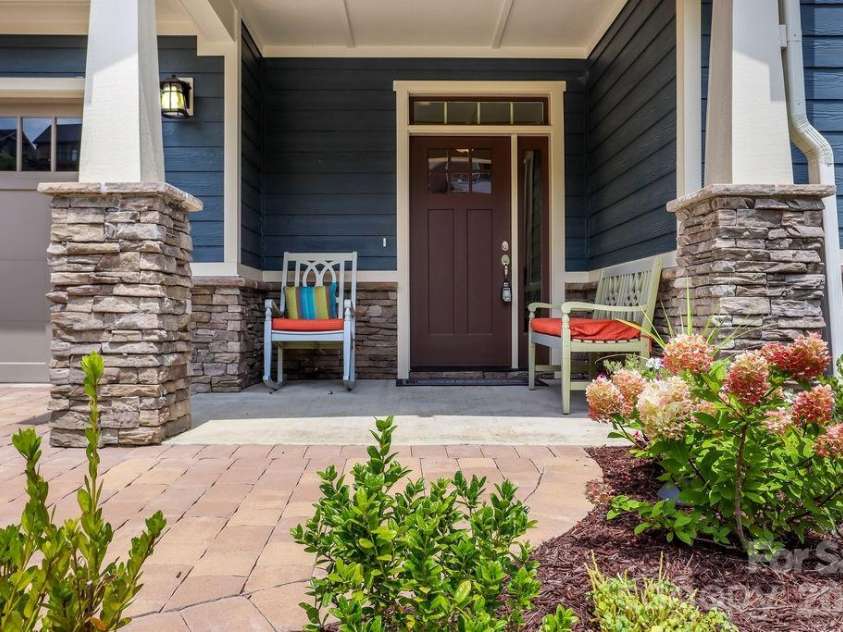 19 Craftsman Overlook Ridge, Arden, NC 28704.  MLS# CAR4342379, YatesRealty ID 6451. Charming front portico, ideal for welcoming guests or enjoying morning coffee