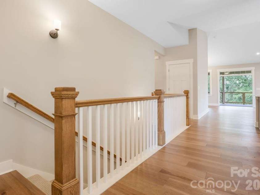 19 Craftsman Overlook Ridge, Arden, NC 28704.  MLS# CAR4342379, YatesRealty ID 6451. Entry hall with stairs leading to lower level.
