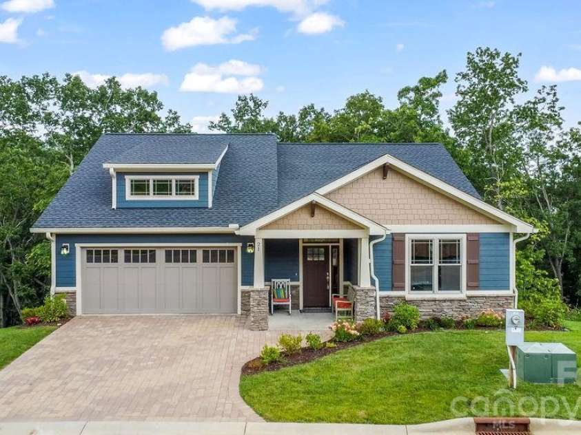 19 Craftsman Overlook Ridge, Arden, NC 28704.  MLS# CAR4342379, YatesRealty ID 6451. Handsome façade featuring stonework, paver driveway, and Craftsman charm