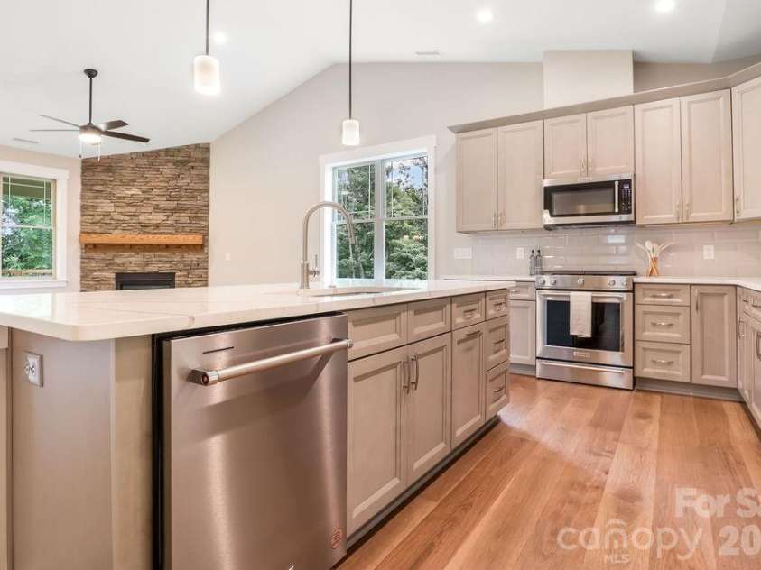 19 Craftsman Overlook Ridge, Arden, NC 28704.  MLS# CAR4342379, YatesRealty ID 6451. Kitchen Aid appliances; dishwasher, gas range and vented microwave all included in home.