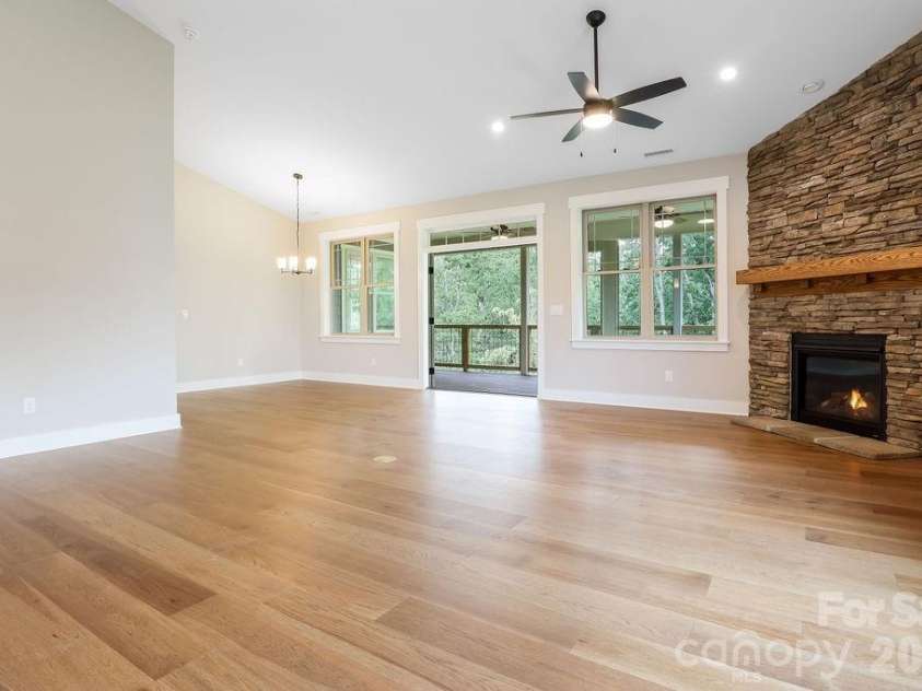 19 Craftsman Overlook Ridge, Arden, NC 28704.  MLS# CAR4342379, YatesRealty ID 6451. Kitchen and great room flows easily into dining room.