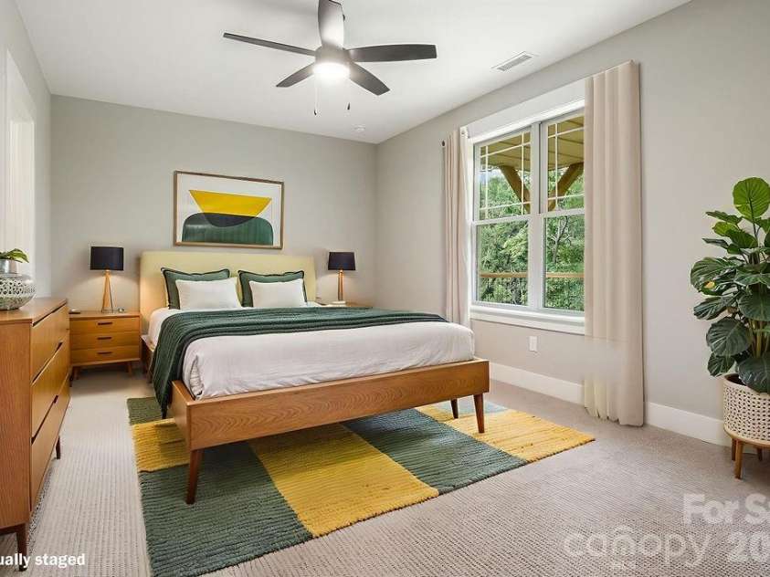 19 Craftsman Overlook Ridge, Arden, NC 28704.  MLS# CAR4342379, YatesRealty ID 6451. Lower level 4th bedroom with ceiling fan and walk-in closet.