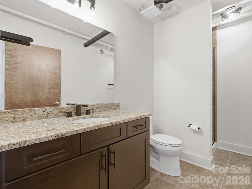 715 Graham Street, Charlotte, NC 28202.  MLS# CAR4383984, YatesRealty ID 6452. Full bath on main level 