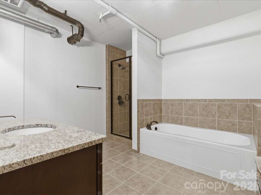 715 Graham Street, Charlotte, NC 28202.  MLS# CAR4383984, YatesRealty ID 6452. Primary Bath