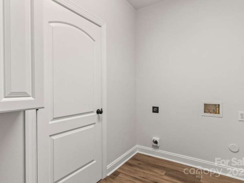 13206 Meadowmere Road, Huntersville, NC 28078.  MLS# CAR4245792, YatesRealty ID 6454. Crisp white cabinets in the laundry room