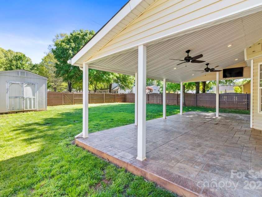 13206 Meadowmere Road, Huntersville, NC 28078.  MLS# CAR4245792, YatesRealty ID 6454. Incredibly rare covered rear porch with ceiling fans and TV