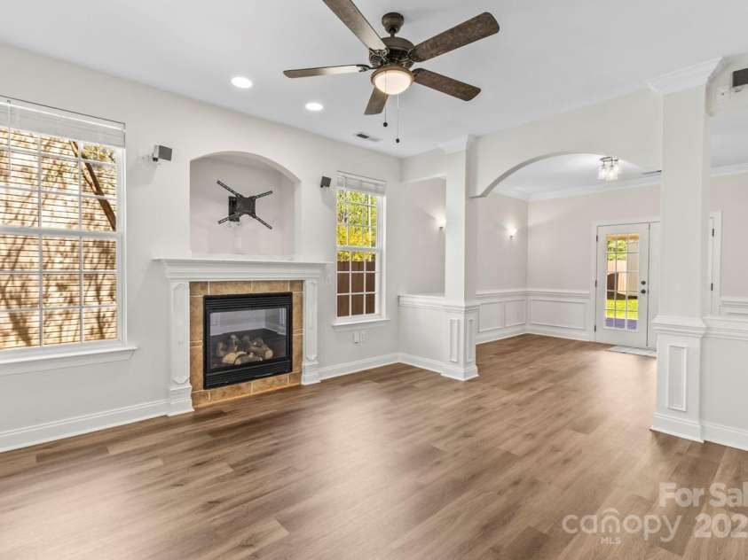 13206 Meadowmere Road, Huntersville, NC 28078.  MLS# CAR4245792, YatesRealty ID 6454. Spacious Family Room open to  dining area with arched column transition