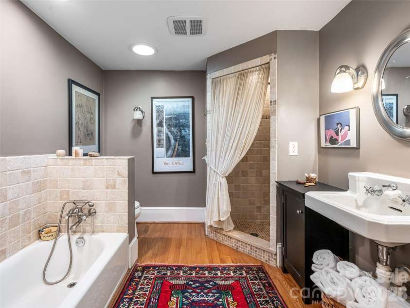 352 Justice Ridge Road, Candler, NC 28715.  MLS# CAR4357207, YatesRealty ID 6458. This large remodeled bathroom has modern updates while maintaining some classic charm.